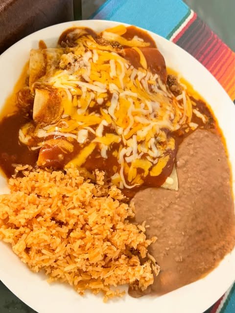 Enchiladas verdes with rice and refried beans